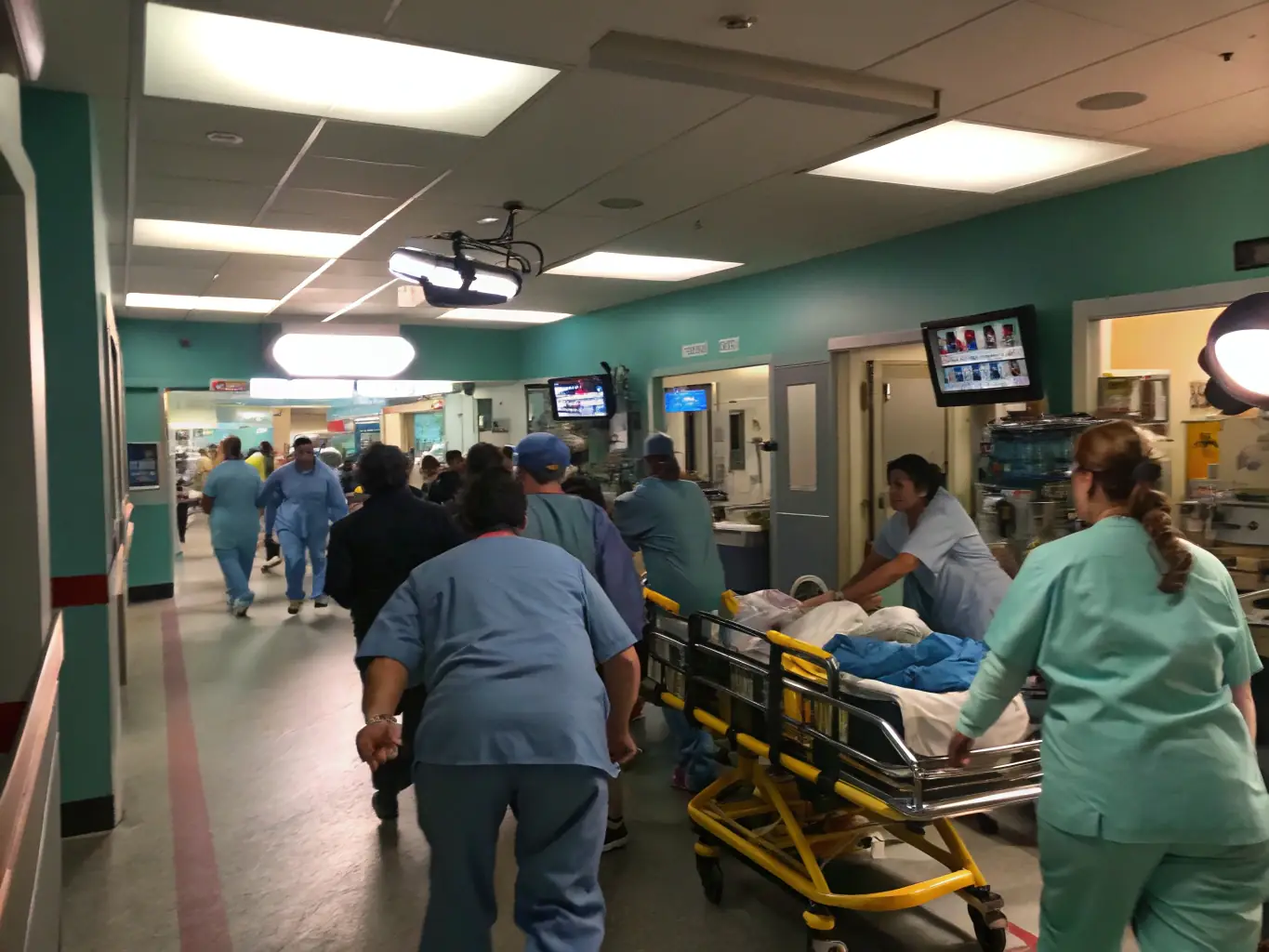 A medical team urgently attending to a patient in the emergency room, highlighting the fast-paced environment and critical care provided during neurological emergencies.